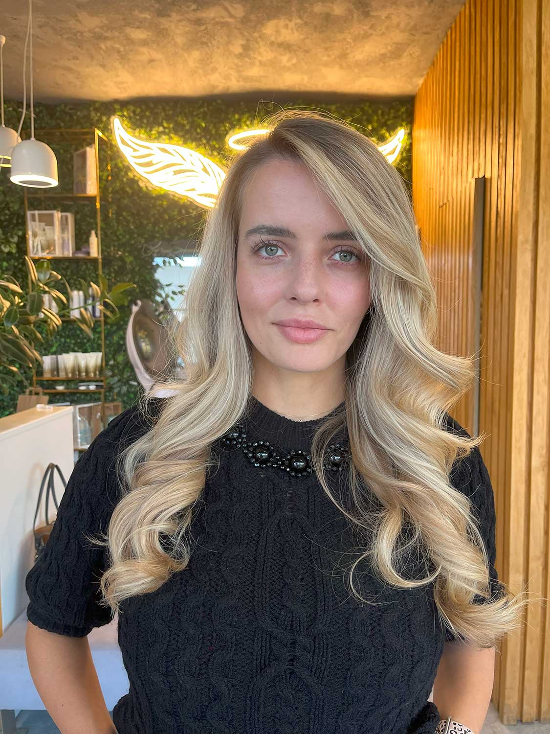 Long blonde hair with soft voluminous curls